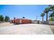 Charming home with a stucco exterior and a spacious front yard with long driveway and a detached garage at 1001 W Northern Ave, Phoenix, AZ 85021
