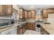 Updated kitchen with granite countertops, stainless steel appliances and farmhouse sink at 1001 W Northern Ave, Phoenix, AZ 85021
