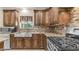 Well-equipped kitchen featuring granite counters, stainless appliances, and custom cabinetry at 1001 W Northern Ave, Phoenix, AZ 85021