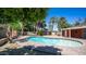 Backyard showing an inground pool surrounded by a brick patio and desert landscaping at 1001 W Northern Ave, Phoenix, AZ 85021