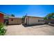 Backyard with two utility sheds and some desert landscaping at 1001 W Northern Ave, Phoenix, AZ 85021