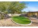 Backyard with artificial turf and desert landscaping at 1108 E Georgia Ave, Phoenix, AZ 85014