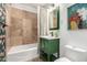Bathroom featuring stylish green vanity with tiled tub at 1108 E Georgia Ave, Phoenix, AZ 85014