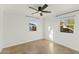 Well-lit bedroom with ceiling fan and neutral tones at 1108 E Georgia Ave, Phoenix, AZ 85014