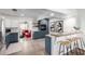 Stylish kitchen with blue lower cabinets, white upper cabinets, and an adjacent breakfast nook at 1108 E Georgia Ave, Phoenix, AZ 85014