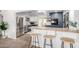 Modern kitchen features two-toned cabinetry, stainless steel appliances, and a breakfast bar for casual dining at 1108 E Georgia Ave, Phoenix, AZ 85014