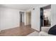 Spacious living room featuring tile floors and views to a connected room with vanity at 1108 E Georgia Ave, Phoenix, AZ 85014