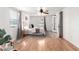 Bright main bedroom featuring hardwood floors, fan, and large windows with natural light at 1108 E Georgia Ave, Phoenix, AZ 85014