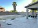 Large backyard area with patio, block fence, palm tree and low maintenance landscaping at 11867 W Alvarado Rd, Avondale, AZ 85392