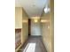 Bright hallway features neutral walls and carpet at 11867 W Alvarado Rd, Avondale, AZ 85392