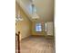 Open living room features neutral carpet, tall ceilings and bright lighting at 11867 W Alvarado Rd, Avondale, AZ 85392