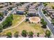 This aerial view shows a community park including a playground and residences at 1187 E Frances Ln, Gilbert, AZ 85295
