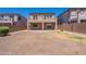 Spacious backyard with two-story home, patio, desert landscaping, and privacy fence at 1187 E Frances Ln, Gilbert, AZ 85295
