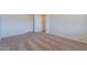 Bedroom featuring carpet, ample closet space with white doors, and neutral paint at 1187 E Frances Ln, Gilbert, AZ 85295