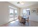 Bright breakfast nook with a cozy round table and access to the back patio through double doors at 1187 E Frances Ln, Gilbert, AZ 85295