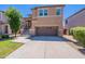 Charming two-story home with a well-maintained lawn and a spacious two car garage at 1187 E Frances Ln, Gilbert, AZ 85295