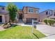 Beautiful two story home boasts a manicured front yard, with a covered entrance and attached two car garage at 1187 E Frances Ln, Gilbert, AZ 85295