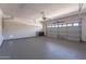 Spacious garage with epoxy flooring and an automatic door at 1187 E Frances Ln, Gilbert, AZ 85295