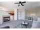 Comfortable upstairs living room with modern decor, neutral carpet, fireplace, and easy kitchen access at 1187 E Frances Ln, Gilbert, AZ 85295