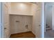 Utility Room featuring tile floor, shelving, and washer/dryer hookups at 1187 E Frances Ln, Gilbert, AZ 85295