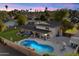 Aerial view of a home with a backyard pool and patio area perfect for outdoor entertaining at 13411 N 50Th St, Scottsdale, AZ 85254