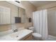 Bathroom with neutral walls, large mirror, white sink and a shower/tub combo offering a functional design at 13411 N 50Th St, Scottsdale, AZ 85254