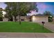 Charming two-story home with a well-manicured front yard, mature trees, and an attached two-car garage at 13411 N 50Th St, Scottsdale, AZ 85254