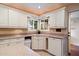 Well-lit kitchen area featuring ample counter space and modern dishwasher at 13411 N 50Th St, Scottsdale, AZ 85254
