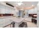 Charming kitchen equipped with an oven, island seating, and ample storage space at 13411 N 50Th St, Scottsdale, AZ 85254