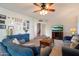 Comfortable living room with plush sofas, ceiling fan and a curated gallery wall at 13411 N 50Th St, Scottsdale, AZ 85254