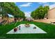 Large backyard with play equipment and ample space for recreation at 1377 W Park Ave, Gilbert, AZ 85233