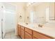 Well-lit bathroom featuring a spacious vanity, tiled floors, and a separate shower and toilet area at 1377 W Park Ave, Gilbert, AZ 85233