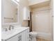 This bathroom features a single sink vanity with a white countertop, a toilet, and a shower-tub combo at 1377 W Park Ave, Gilbert, AZ 85233