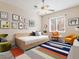Modern bedroom showcases stylish decor, a cozy daybed, colorful accents, and a ceiling fan at 1377 W Park Ave, Gilbert, AZ 85233