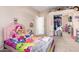 Vibrant bedroom featuring carpeted floors, decor, and closet space at 1377 W Park Ave, Gilbert, AZ 85233