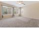Spacious carpeted bedroom with large windows provides ample natural light and comfort at 1377 W Park Ave, Gilbert, AZ 85233