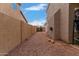 Long side yard with desert landscaping, leading to the backyard access gate at 1377 W Park Ave, Gilbert, AZ 85233