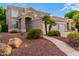 Charming two-story home featuring a desert landscape, curved walkway, and a three car garage at 1377 W Park Ave, Gilbert, AZ 85233