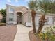 This inviting two story home boasts curb appeal with palm trees, pavers and desert landscaping at 1377 W Park Ave, Gilbert, AZ 85233