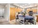 Eat-in kitchen with light wood cabinetry, granite counters, tile flooring and stainless steel appliances at 1377 W Park Ave, Gilbert, AZ 85233