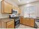 Bright kitchen featuring granite countertops and stainless steel appliances at 1377 W Park Ave, Gilbert, AZ 85233