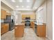 Bright kitchen featuring stainless steel appliances and a kitchen island at 1377 W Park Ave, Gilbert, AZ 85233