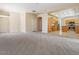 Large open living room transitioning into a bright kitchen area at 1377 W Park Ave, Gilbert, AZ 85233
