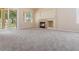 Large living room with fireplace and sliding glass doors to the backyard at 1377 W Park Ave, Gilbert, AZ 85233