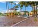 Community playground featuring a colorful play structure and picnic area for Gathering fun at 1377 W Park Ave, Gilbert, AZ 85233