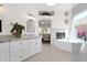 Spacious bathroom with dual vanity, soaking tub, fireplace and large window at 13914 E Laurel Ln, Scottsdale, AZ 85259