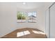 Bright and airy bedroom with wood floors and dual windows offering pleasant outdoor views at 13914 E Laurel Ln, Scottsdale, AZ 85259