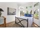 Comfortable bedroom with large windows offering scenic outdoor views, complemented by stylish decor at 13914 E Laurel Ln, Scottsdale, AZ 85259
