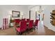 Elegant dining room featuring a large table, stylish seating, and bright lighting creating a welcoming atmosphere at 13914 E Laurel Ln, Scottsdale, AZ 85259