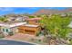 Stunning home with three-car garage, a tiled roof, and mountain views at 13914 E Laurel Ln, Scottsdale, AZ 85259